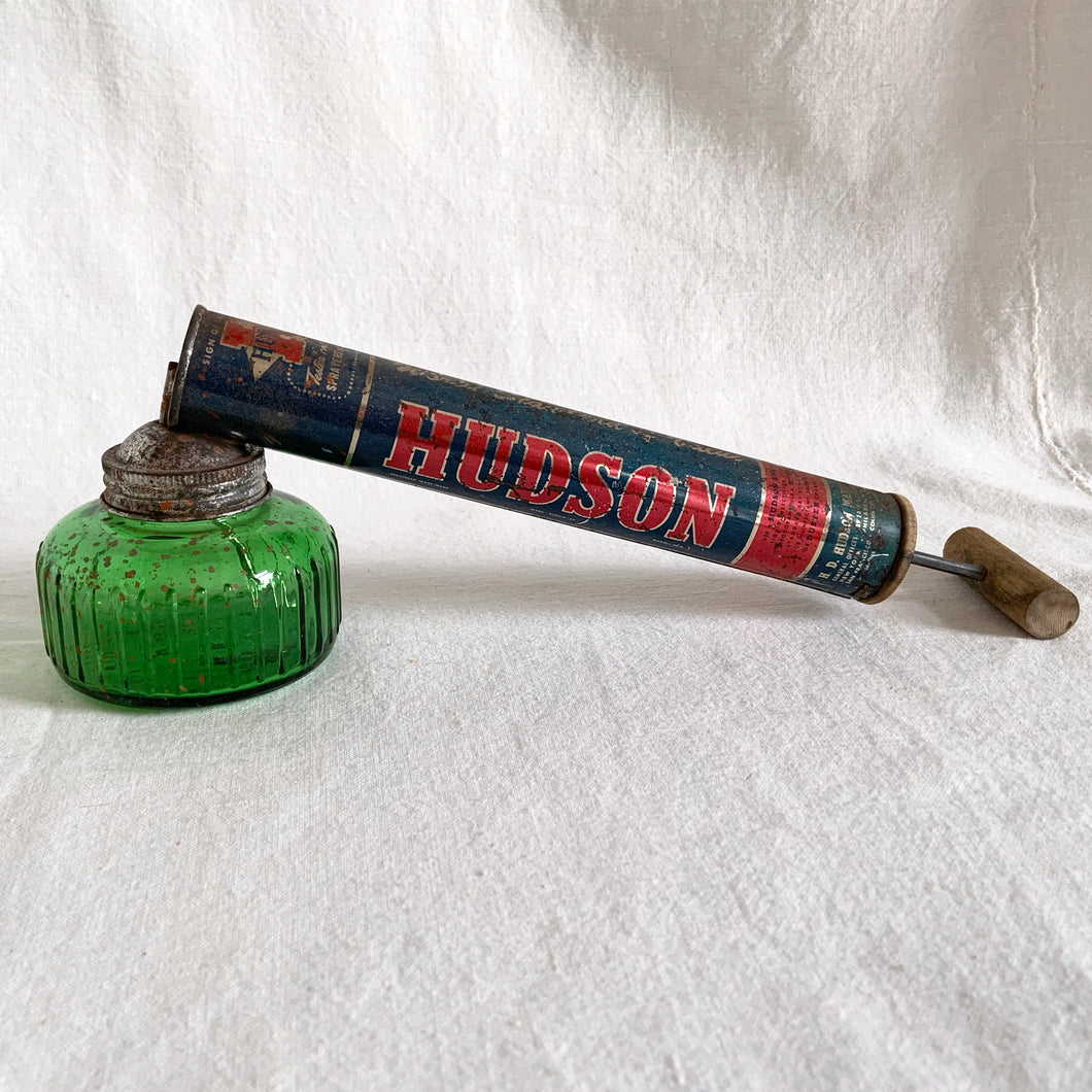 You don't have to be a gardner to appreciate the fabulous navy & red graphics paired with gorgeous deep green glass (removable) on this vintage garden sprayer. A perfect addition to your vintage decor! Excellent condition and the tube still has compression  should you wish to use it as intended.  Measures 15 inches in length
