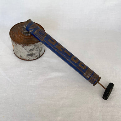 A great branded vintage sprayer with wonderfully preserved graphics of the Unico company. Made in Canada, eh?   Operated by a manual hand pump with wood handle and metal barrel for liquid.  Measures 16 inches in length