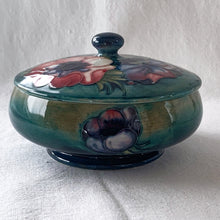Load image into Gallery viewer, Stunning vintage mid-century tube lined and hand painted &quot;Anemone&quot; lidded dish. Produced by Moorcroft Pottery, England, circa 1950s. A vibrant and gorgeous piece to depth to your decor.  Measures 5-3/4&quot; x 3-1/2&quot;  In excellent condition, free from chips/cracks/repairs. Normal crazing for a piece of this age.
