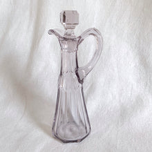 Load image into Gallery viewer, Elegant antique vinegar (dressing) pitcher with stopper. The glass has a slight purple tinge because the manganese in the glass turned violet in sunlight which makes it that much more beautiful.  In excellent condition, no chips or cracks.  Measures 3 1/4 x 5 3/4 inches
