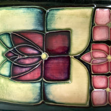 Load image into Gallery viewer, Beautiful vintage art deco style ceramic tray, decorated in the &quot;Violet&quot; pattern on a deep blue ground with shades of green and pink. Design by Sally Tuffin in 1991. Shape 965. Produced by Moorcroft Pottery.  In excellent condition, free from chips, cracks, repairs. Crazing present. Offered from our personal collection.   Measures 3-1/2&quot; x 8&quot; x 1/2&quot;
