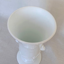 Load image into Gallery viewer, Beautifully detailed art deco style, opaque white glass vase. Pretty scroll handles and a scalloped shell motif in a tapered urn shape.  In excellent condition, free from chips or cracks. Marked &quot;Vitrock&quot; on the bottom.  Measures 4 1/4 x 7 3/4 inches
