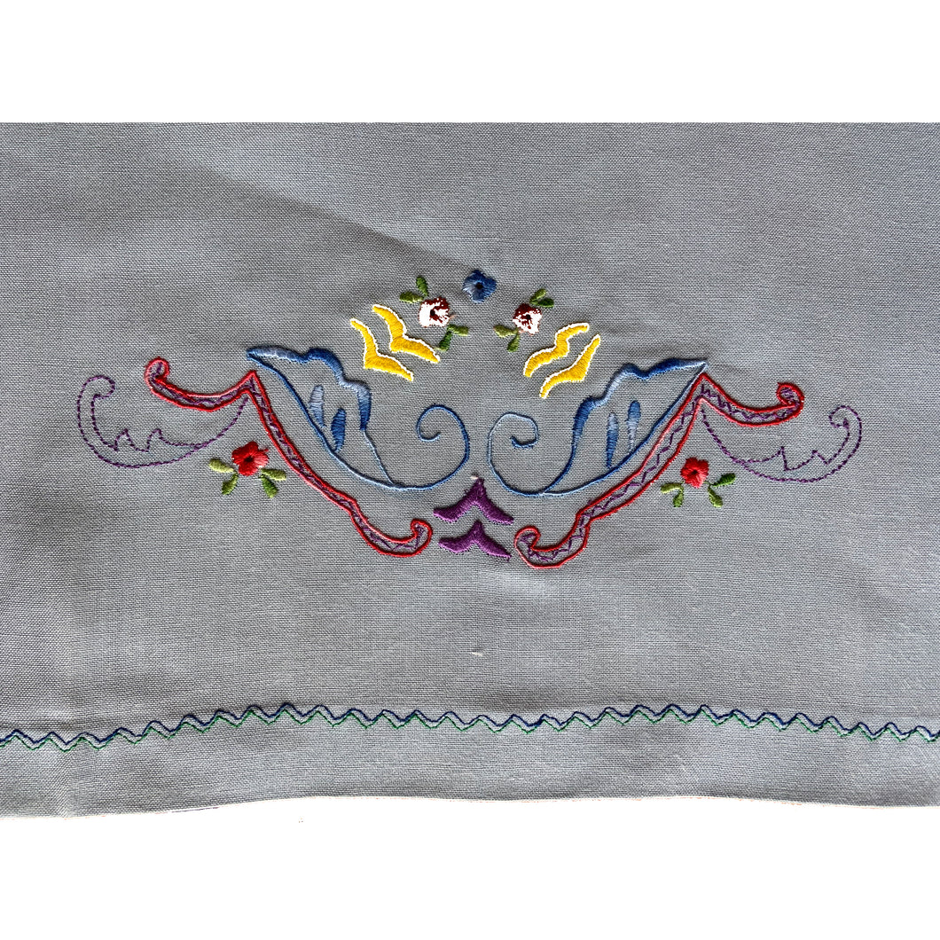 Beautifully stitched vintage embroidered panels on light blue cotton fabric stitched with 3 different designs. Excellent condition. Laundered and steamed.  Would make lovely cafe curtains or could be repurposed into pillows, pillowcases or laundry bags.