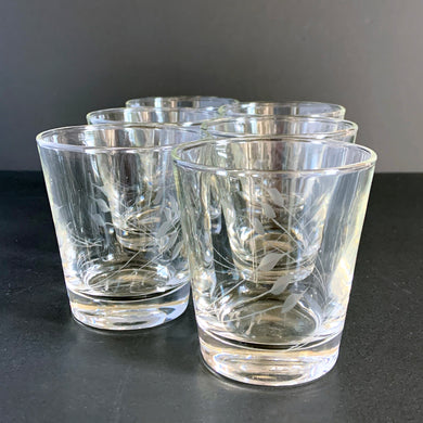 This fabulous set of six vintage whiskey or lowball glasses feature a spray of etched leaves. These simple and elegant glasses will add finesse to your bar cart...cheers!  In excellent vintage condition, no chips or cracks.  Measures 3 1/2x 3 1/4 inches   