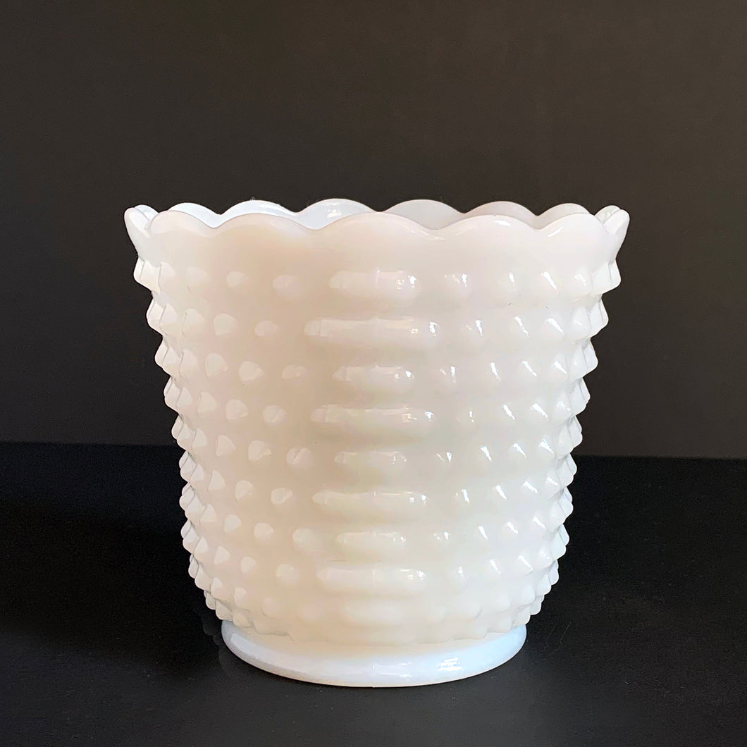 This beautiful, simple and elegant vintage milk glass planter features a hobnail design with a lovely scalloped edge. Produced by the Anchor Hocking Glass Company, circa 1960s. This planter is the perfect vessel for greenery, flowering plants or even repurse as a pen or paintbrush holder. Ideal cottage, shabby chic or wedding decor. You can't go wrong with this classic piece!  In excellent condition, no chips or cracks.  Measures 5-3/4