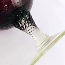 Load image into Gallery viewer, This gorgeous art glass goblet features a lovely vertically fluted optic amethyst glass and the clear twisted stem adds a lovely finishing touch. A great example of mid-century modern art glass to add to your decor collection. Produced in the Empoli Region of Italy, between 1950 to 1970 and was imported by Giftcraft of Toronto (sticker on bottom).  In excellent  condition, no chips or cracks.  Measures 10 inches
