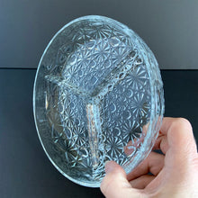 Load image into Gallery viewer, This glass relish dish reflects the light with such brilliance, you&#39;re going to need sunglasses to see all the daisy and button details! Produced by the Indiana Glass Company, USA, circa 1940s.  In excellent condition, no chips or cracks.  Measures 7 1/2 x 1 1/2 inches

