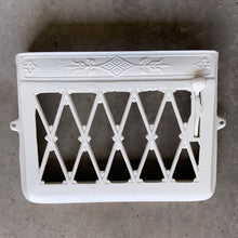 Load image into Gallery viewer, This antique heating vent register cover has been painted a creamy white. Use as intended, or flip it upside down and attach it to the wall for a unique mail, magazine or newspaper holder.
